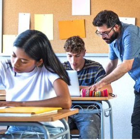 students studying along with teacher