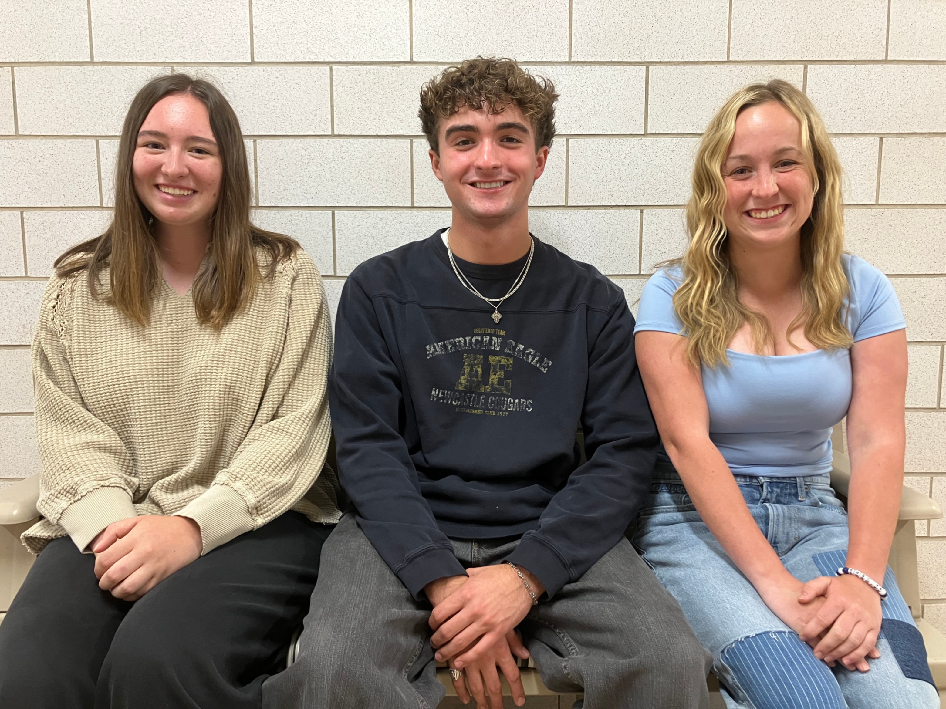 Olivia Miller, Kamden Means, and Emma Wilson pose for a photo.
