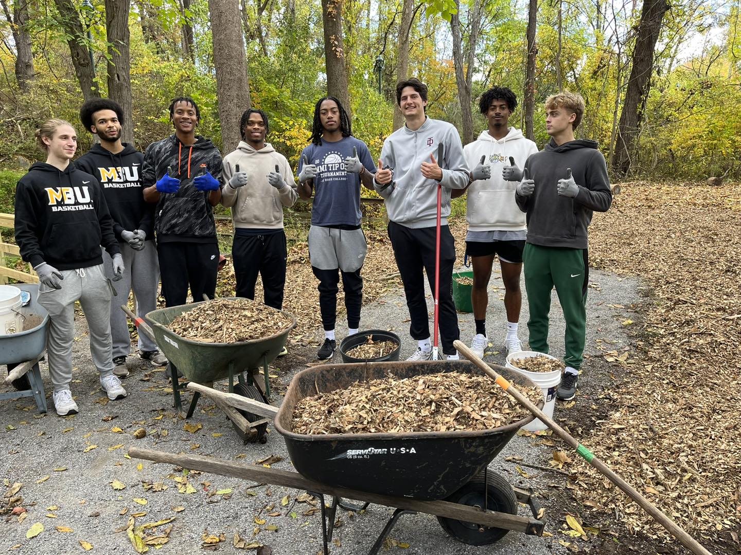 Men with Barrels full of Leaves 