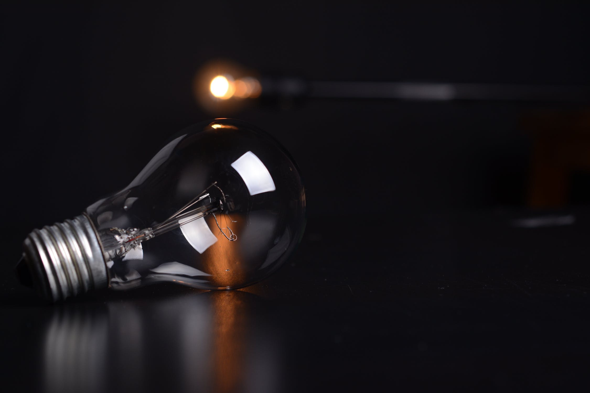 An unlit lightbulb resting on a table