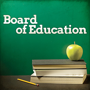 The words "Board of Education" in white text against a green chalkboard background, with a stack of books, a green apple, and a pencil on a desk below.