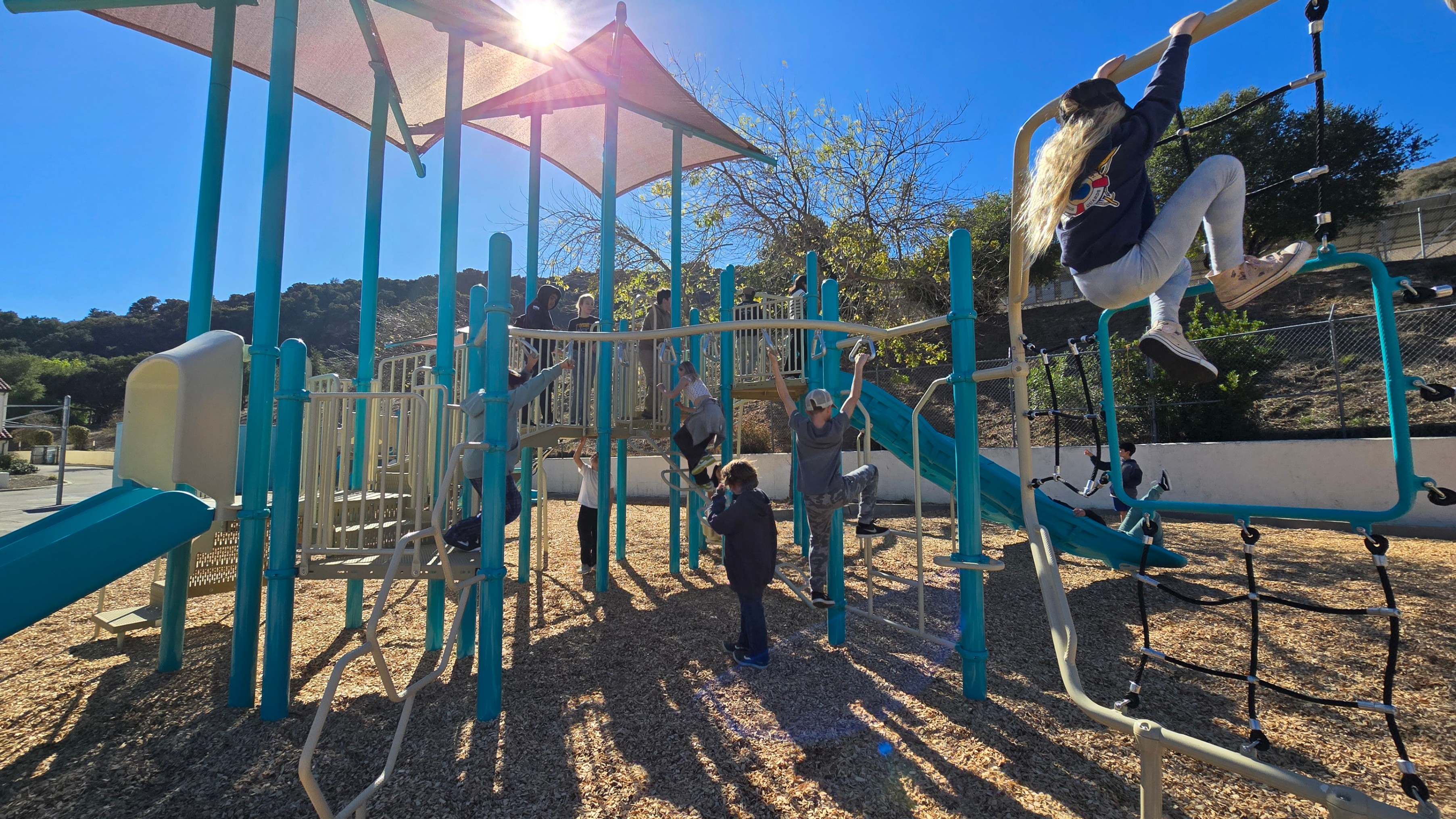 students play on the new playground
