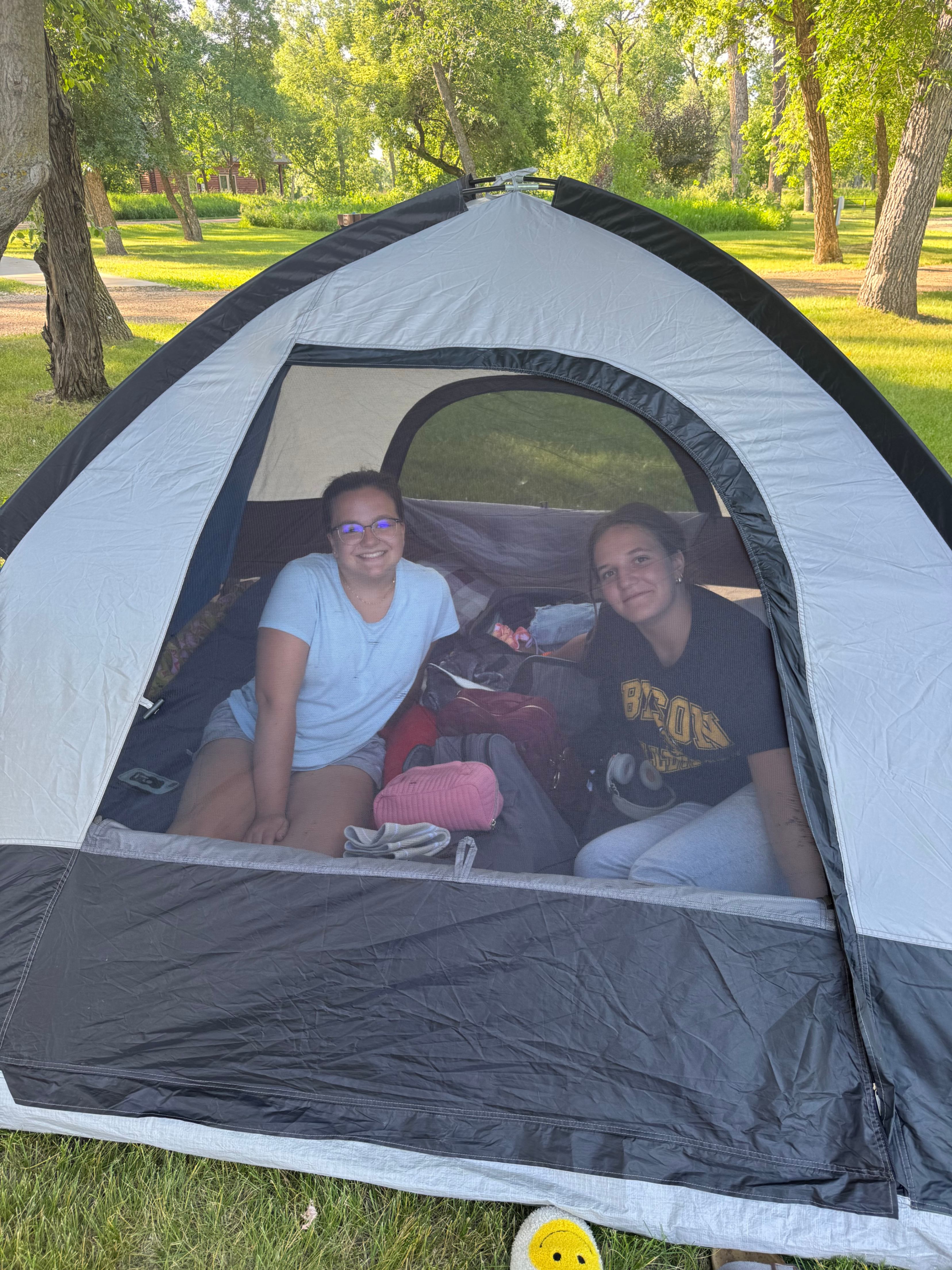picture of two girls in a camping tent