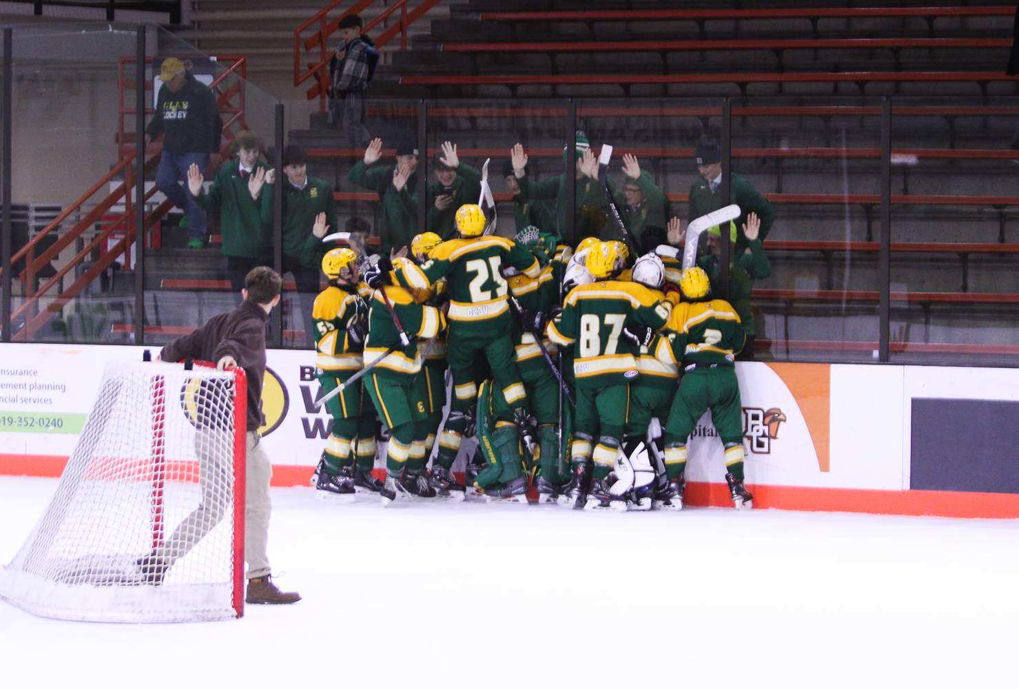 JV celebrates after it's first game, victory