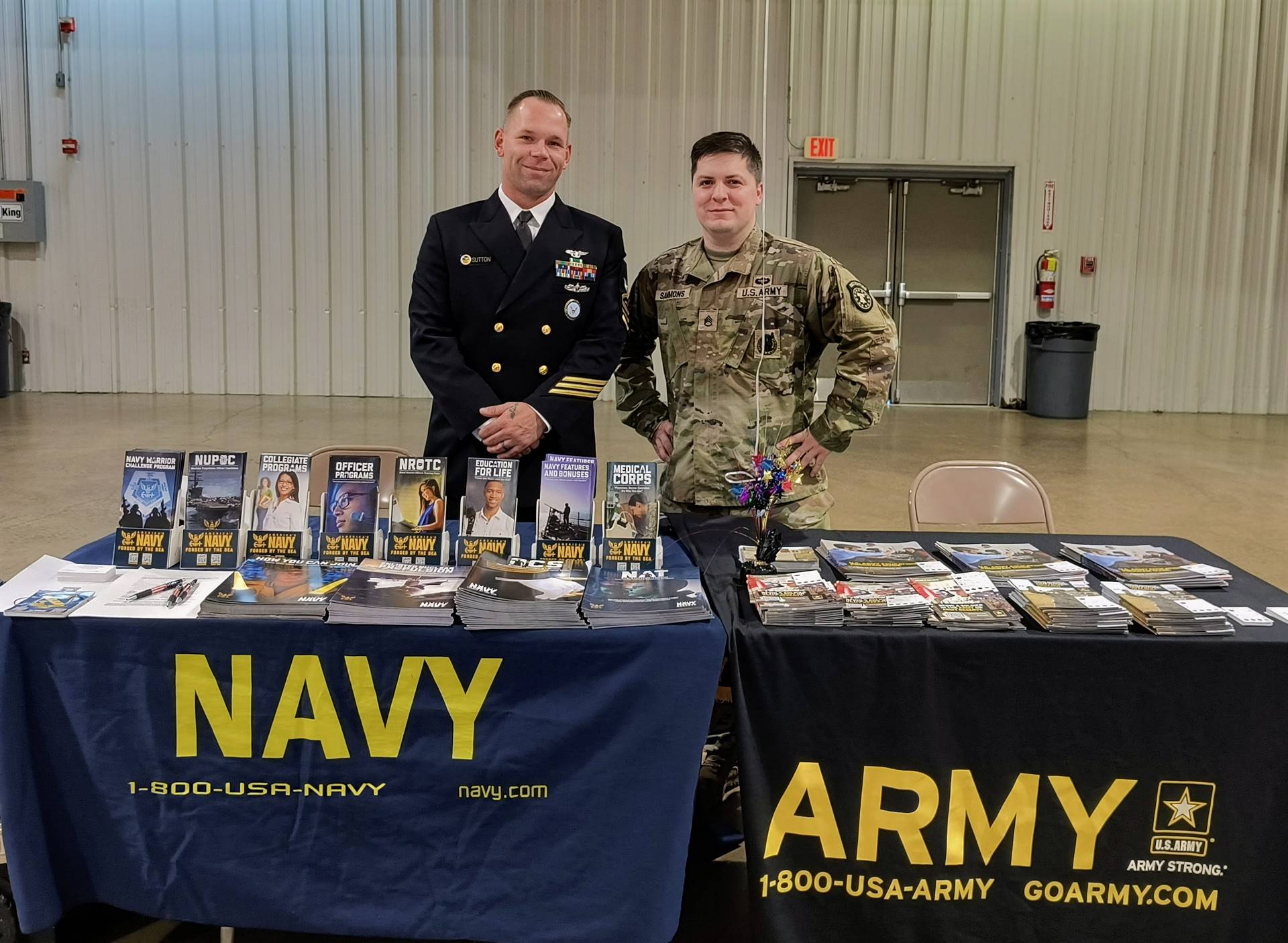 Army and Navy recruiters at their tables