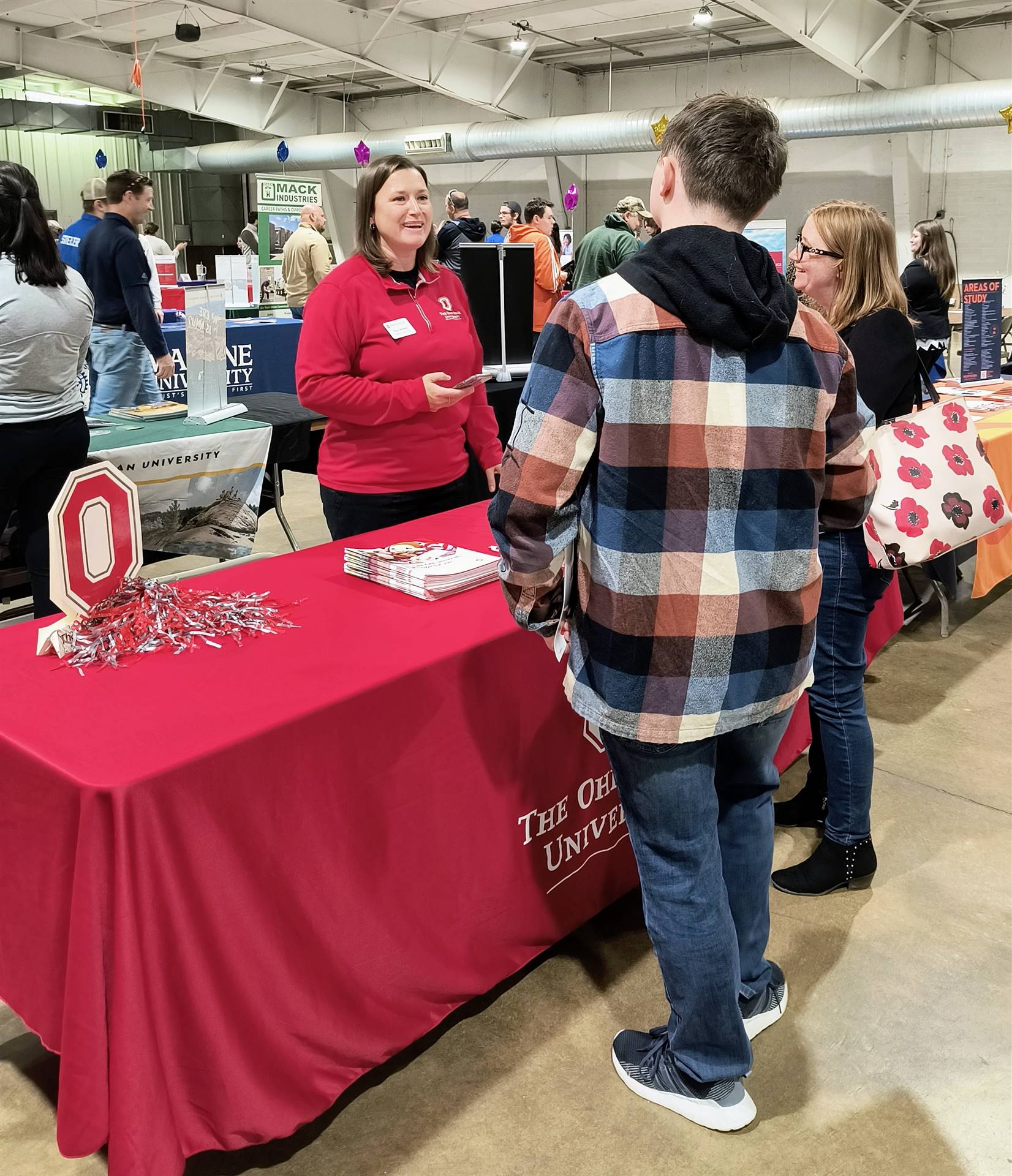 Ohio State University rep speaking with student
