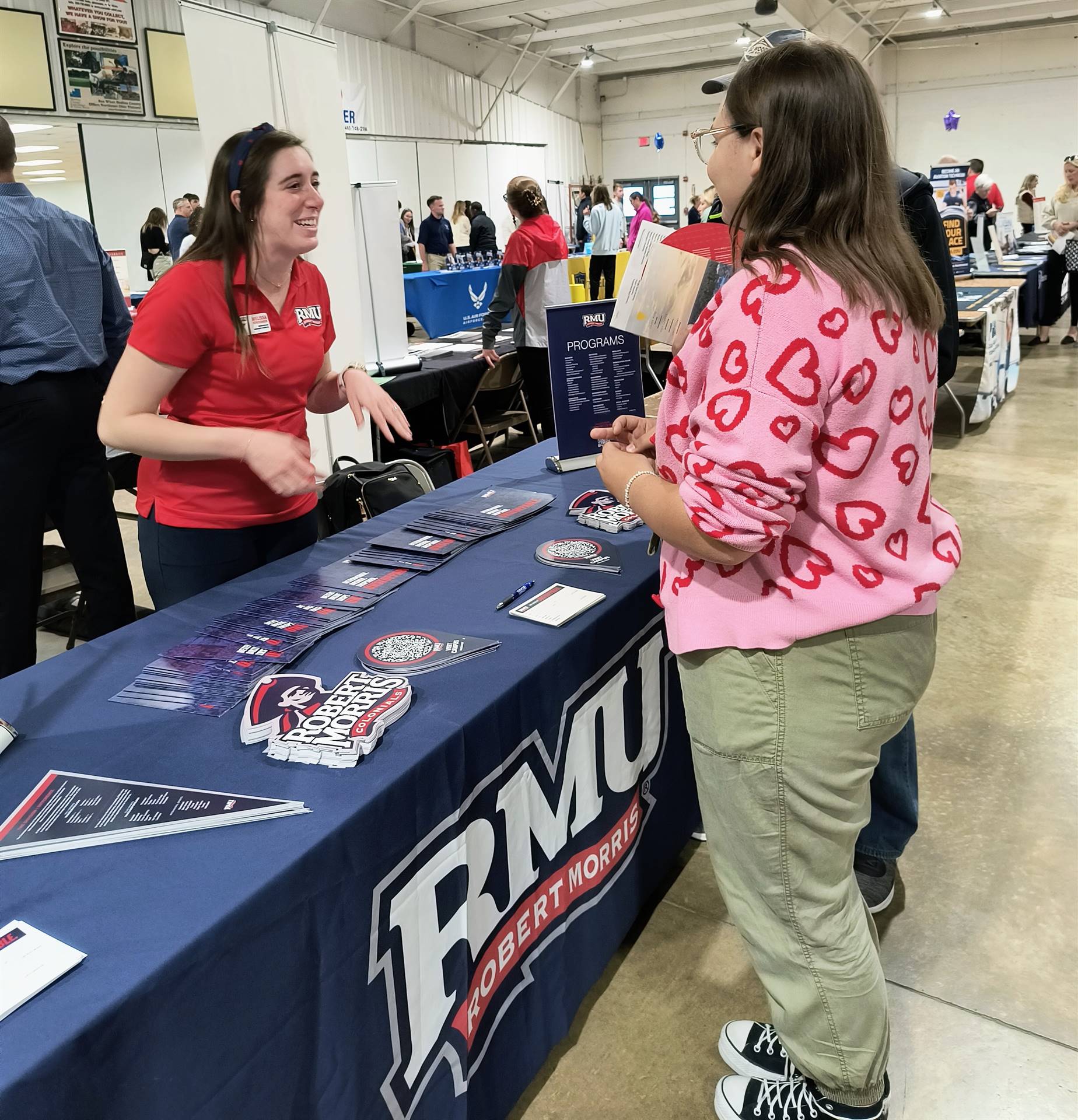 Robert Morris University presenter talking to student