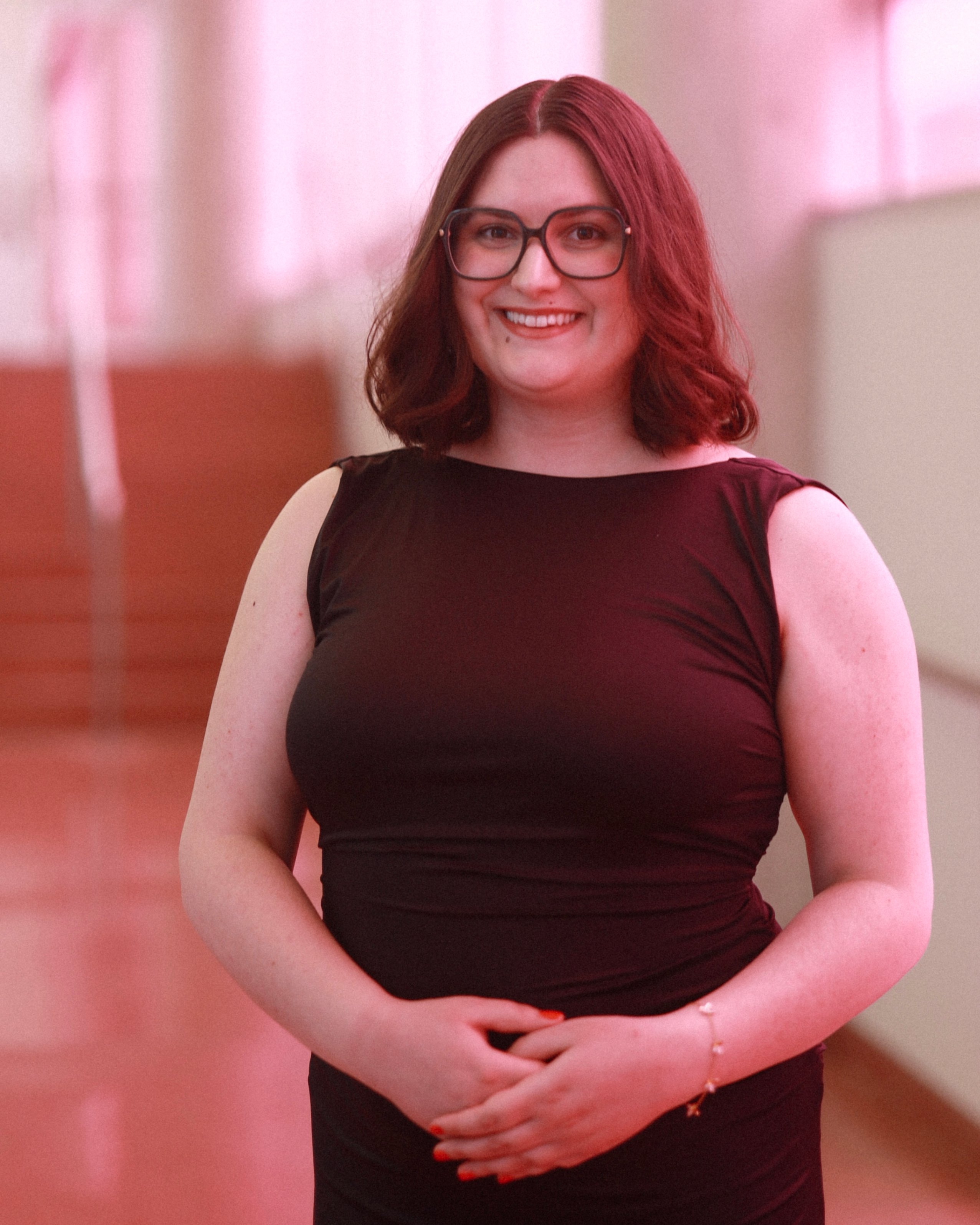 smiling lady with red colored background