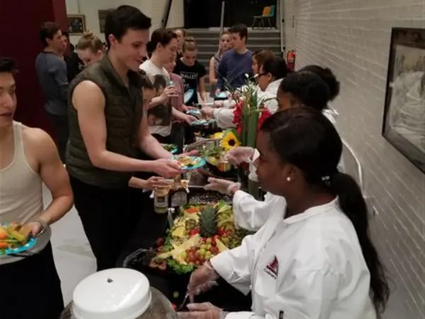 CA Program student serving food