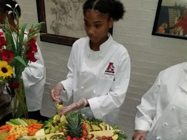 CA Program student serving food