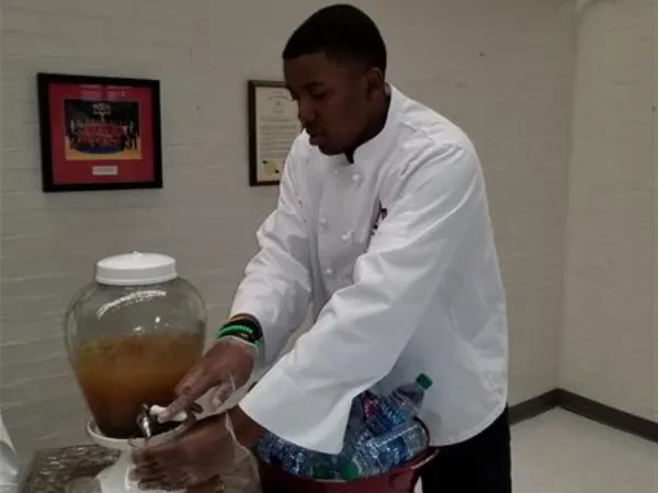 CA Program student serving food
