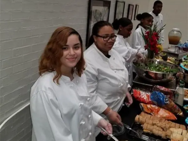 CA Program student serving food