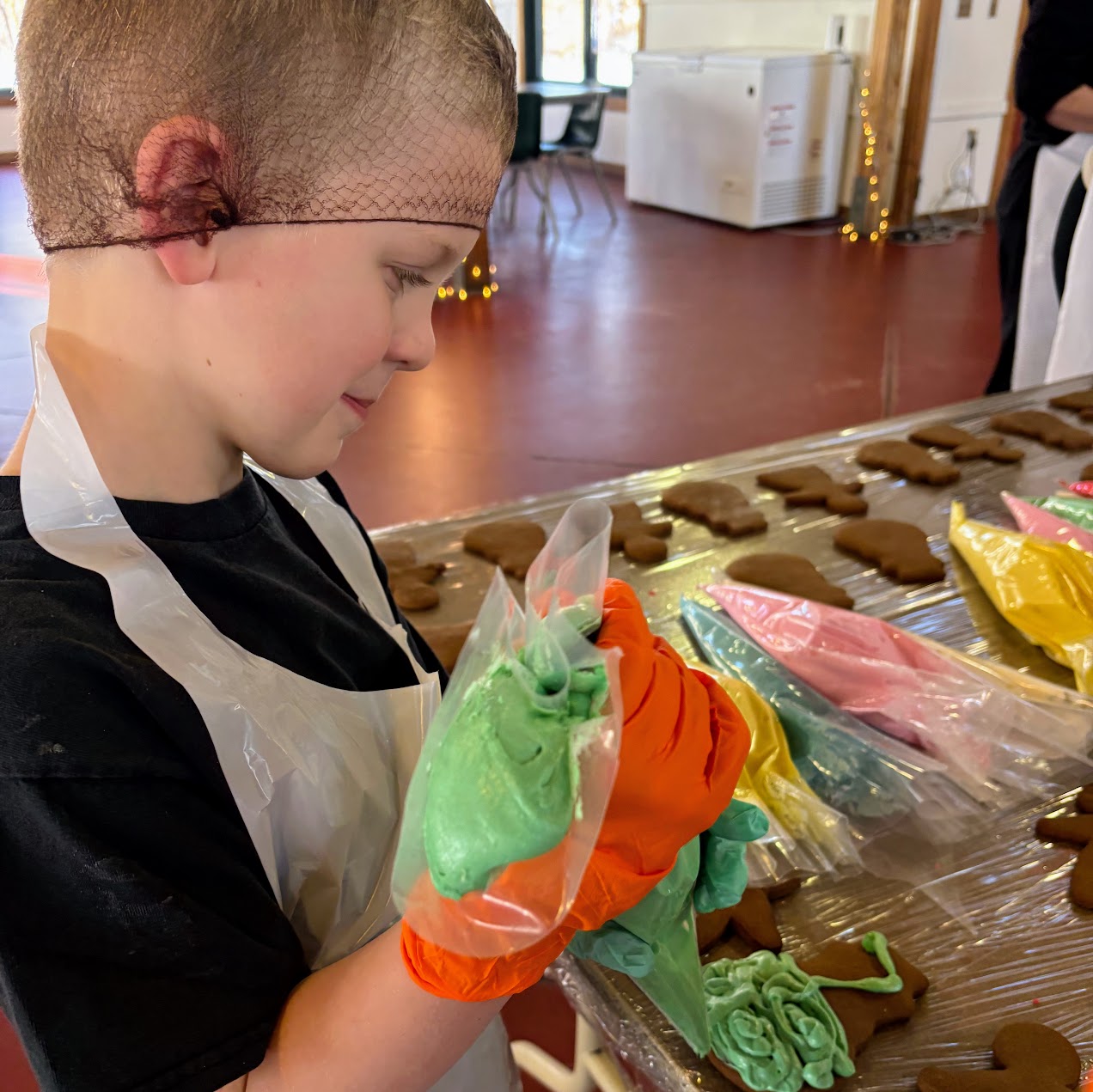 Student decorating cookies