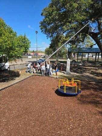 Students Installing flag pole at war memorial park