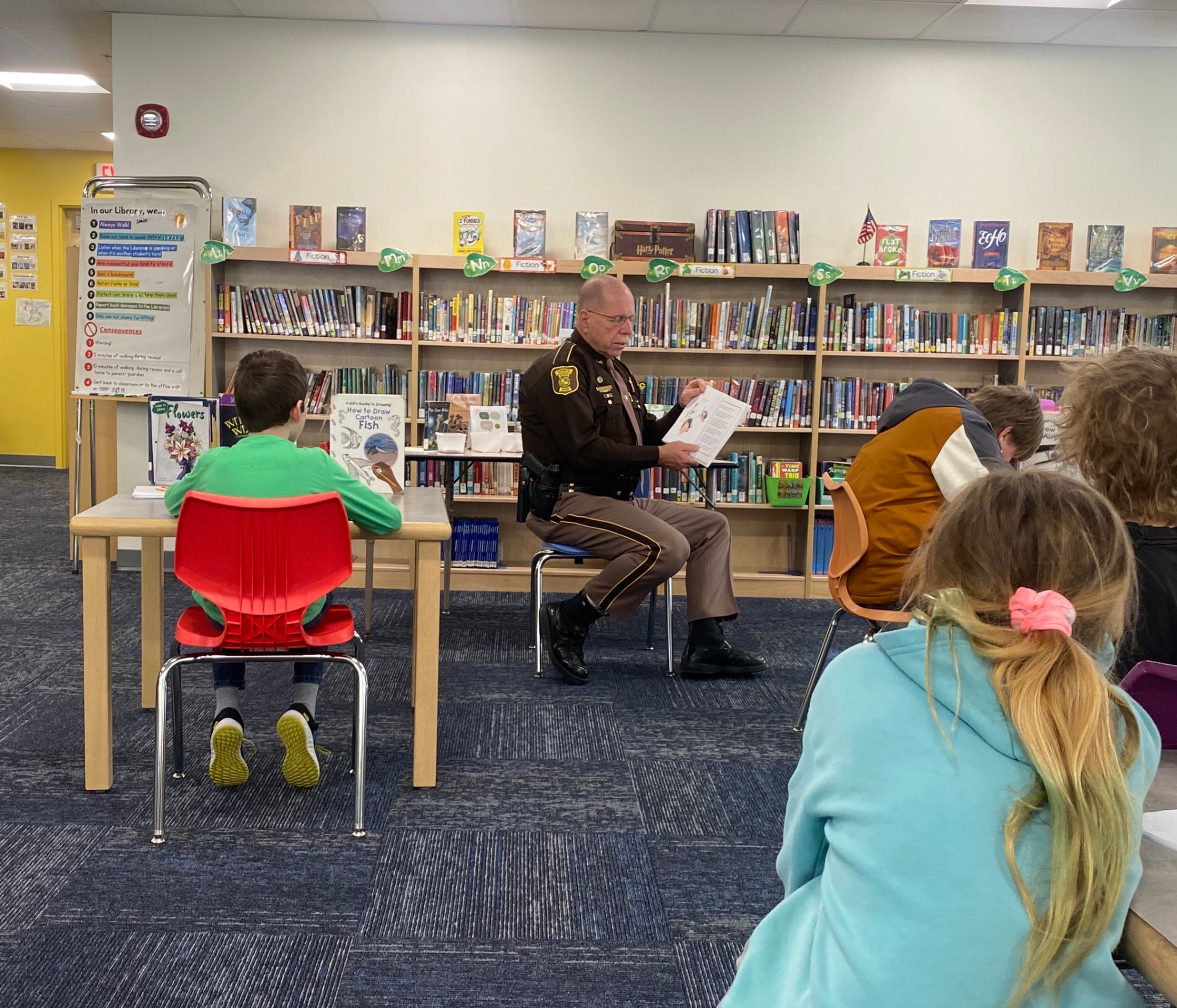 Sheriff Kevin Joyce Reading a Book on How to Deal with Bullies