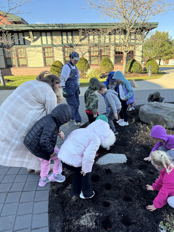 A group of kindergarten students planting their tulip bulbs at WES.