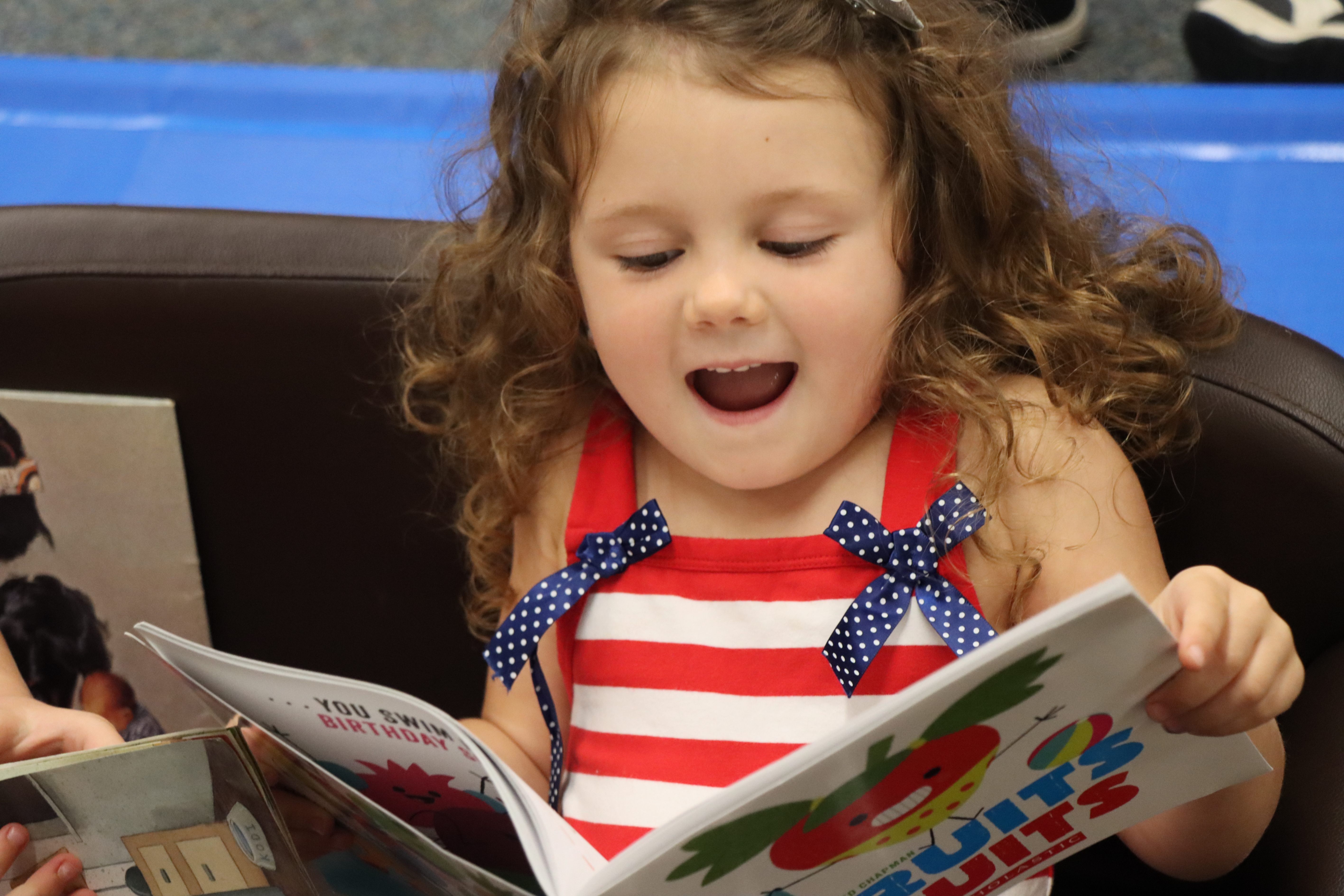preschooler reading a picture book