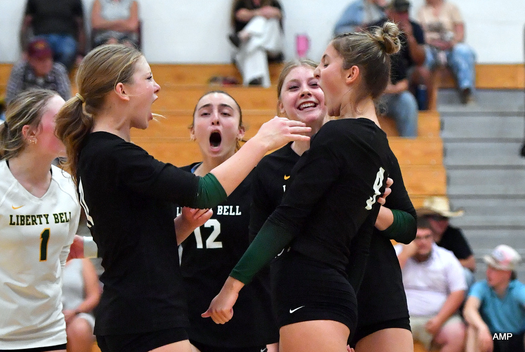 Lady Lions celebrate a point against Okanogan