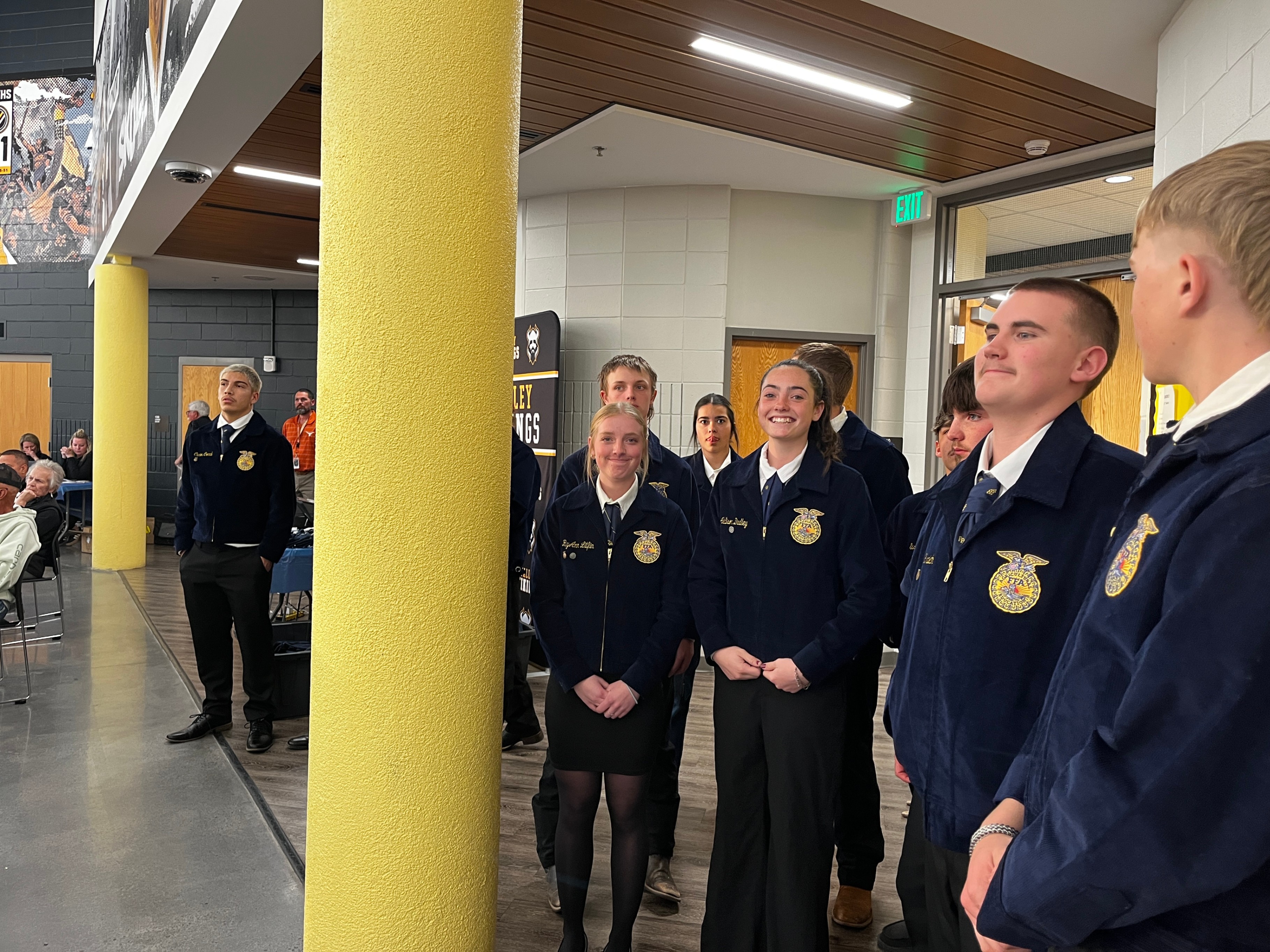 a group of students in their FFA Jackets smiling 