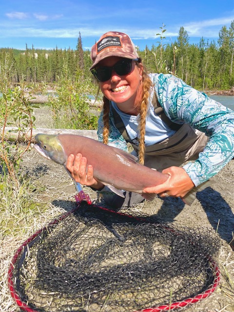 woman holding a fish 