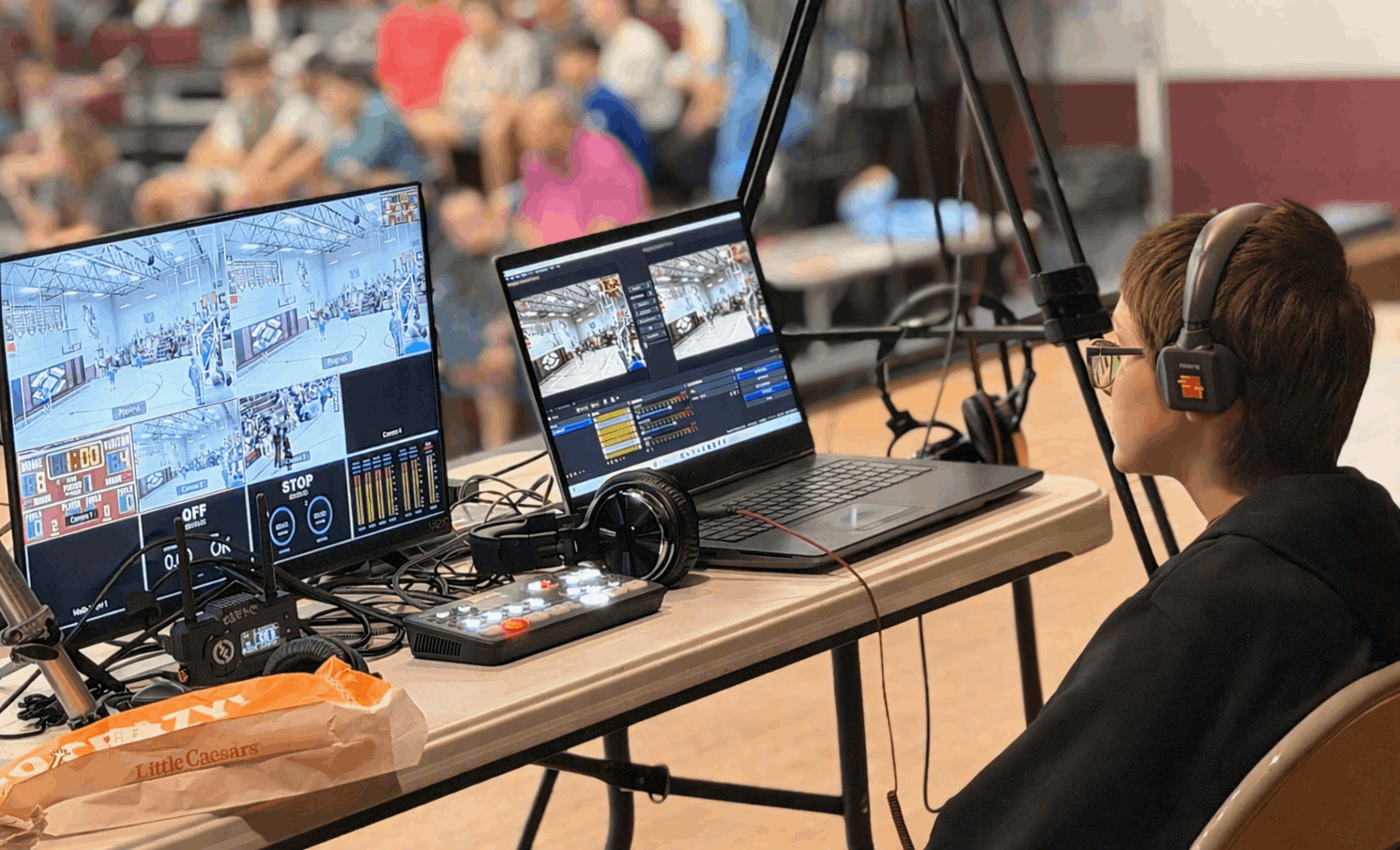 Student running live stream at middle school volleyball game