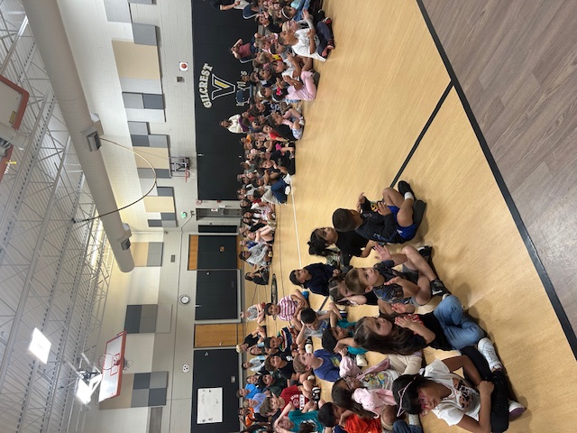 Students in a Gym for an assembly.