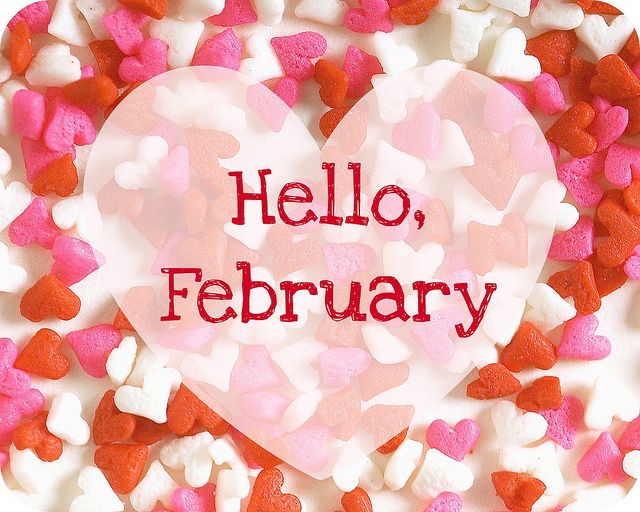 pink, red, and white hearts in the background with white hearts with the words "Hello, February"