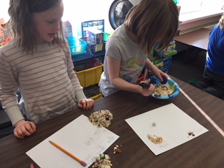 students working on an experiment in the classroom