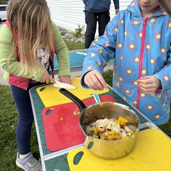 students cutting up vegetables