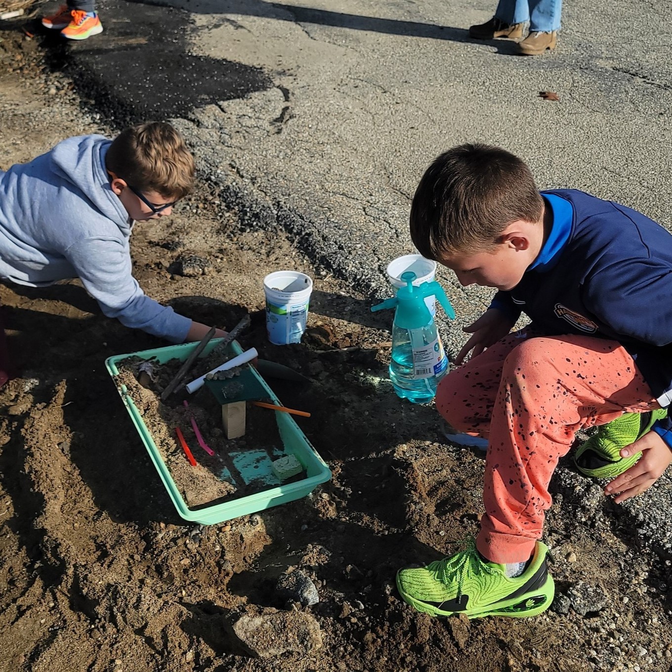 students digging in the dirt