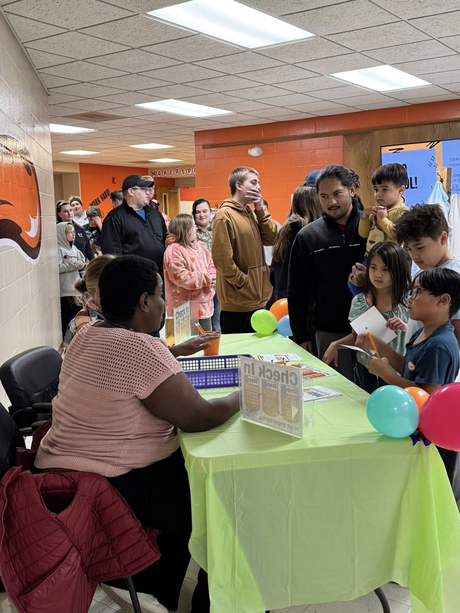 Families wait to check in before going off to enjoy the night. 