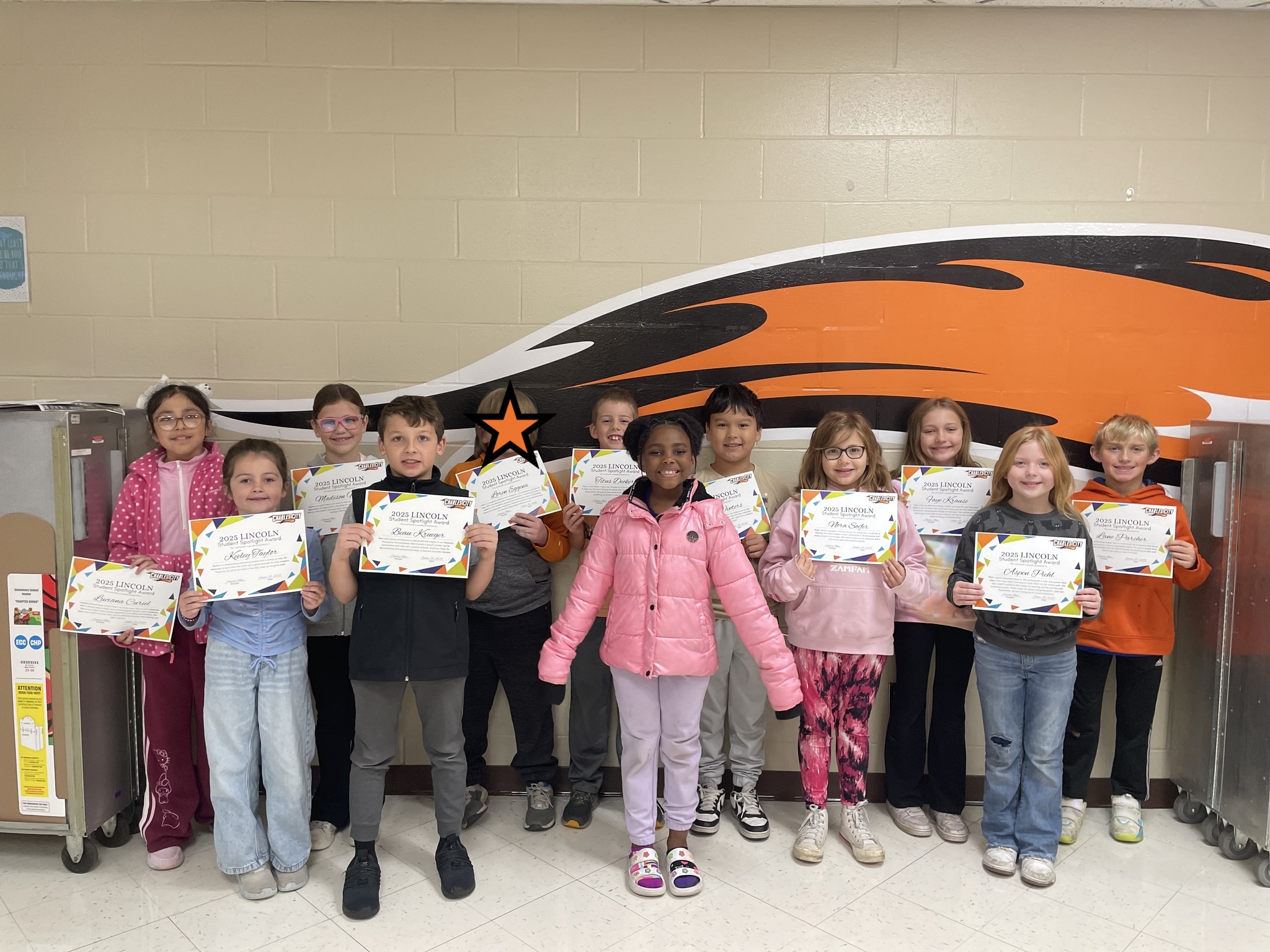 Students holding their certificates