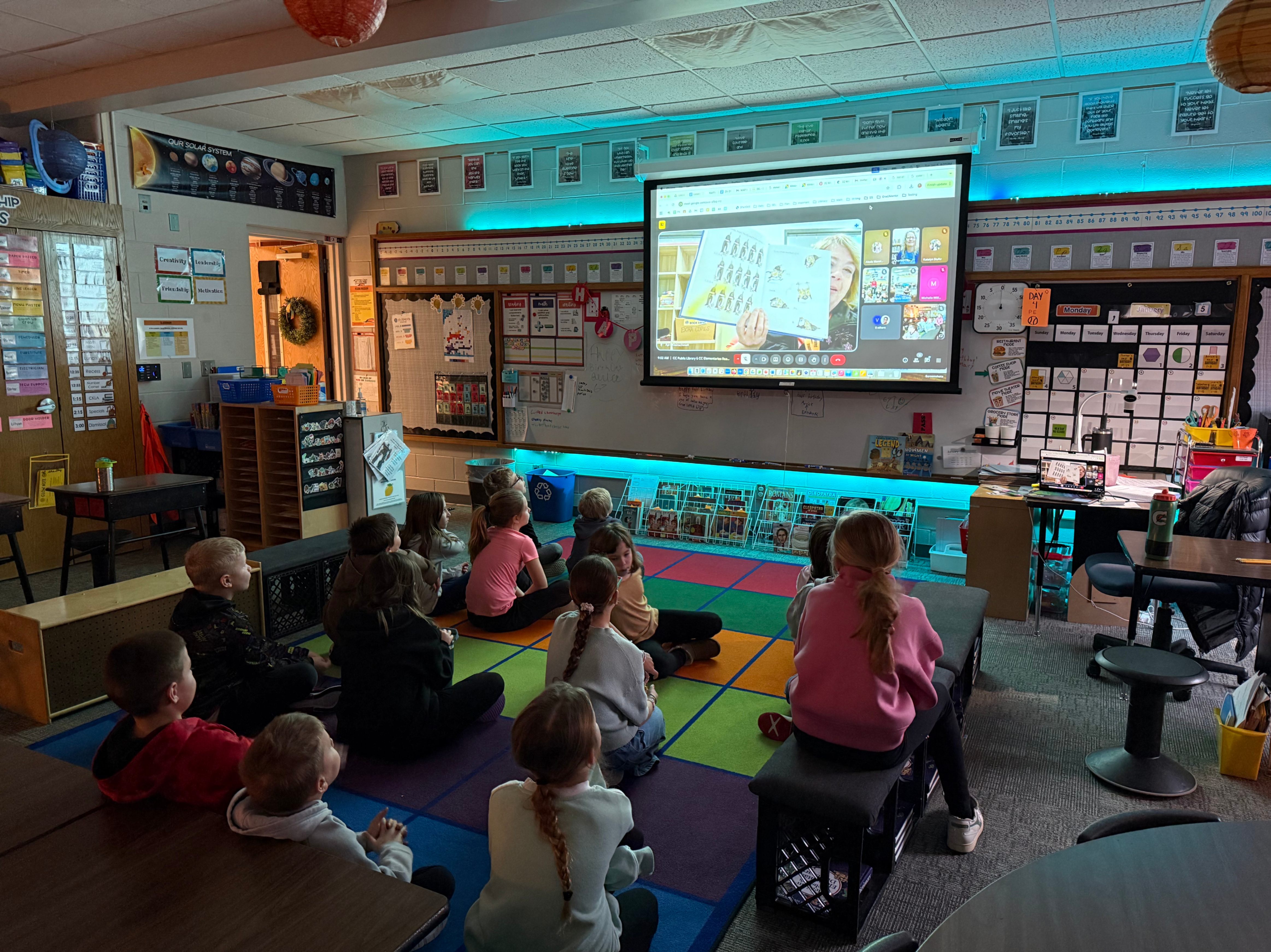students watch a video of a read aloud