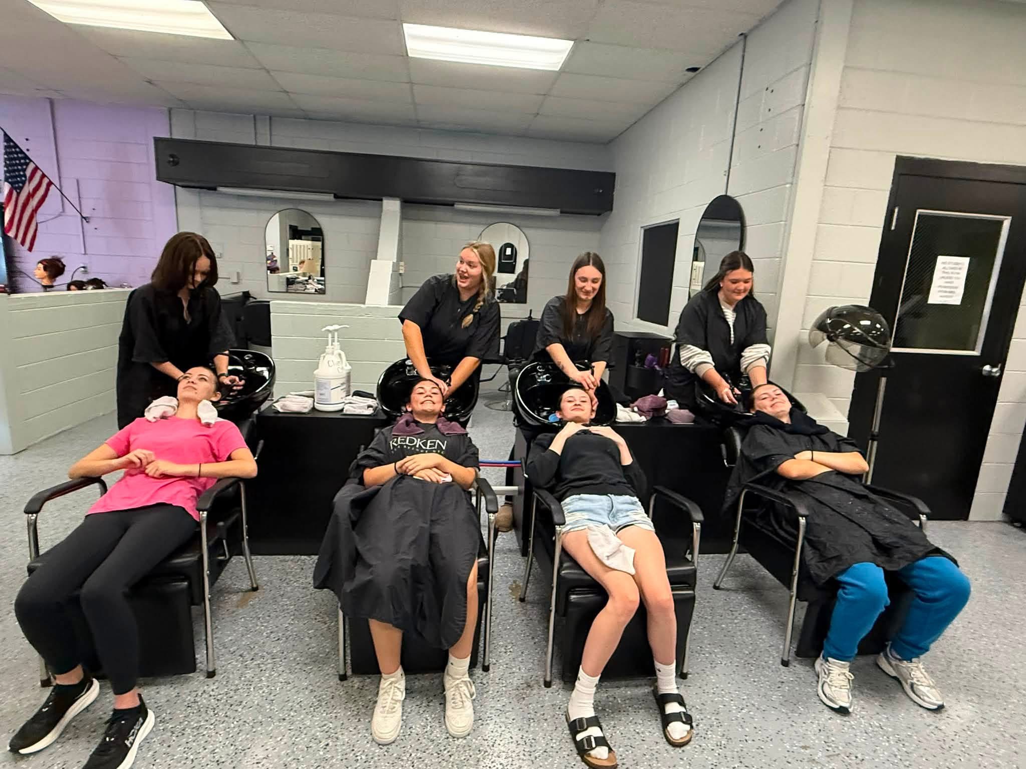 Cosmo 1 & 2 students washing hair
