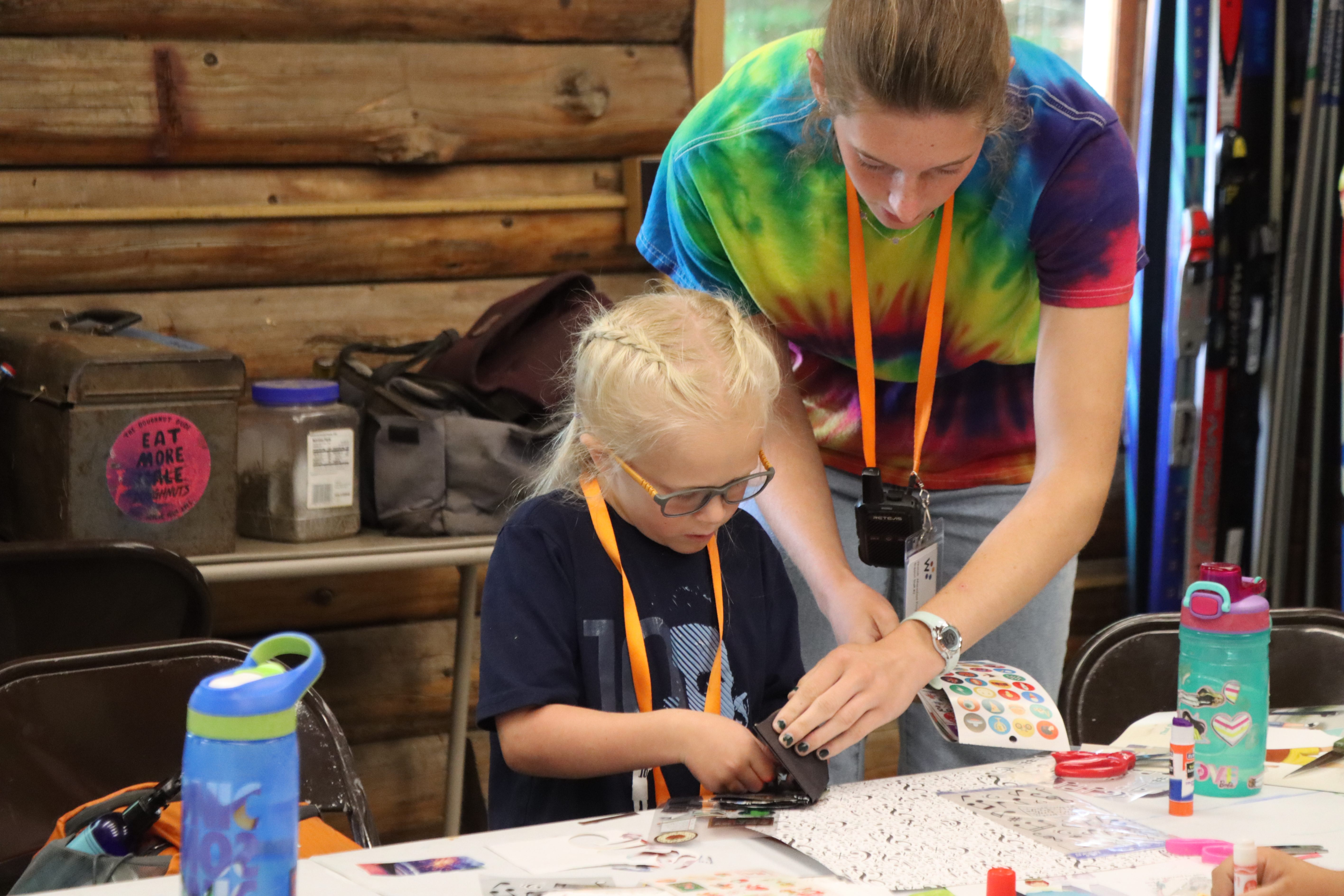 camper working on her mini-magazine