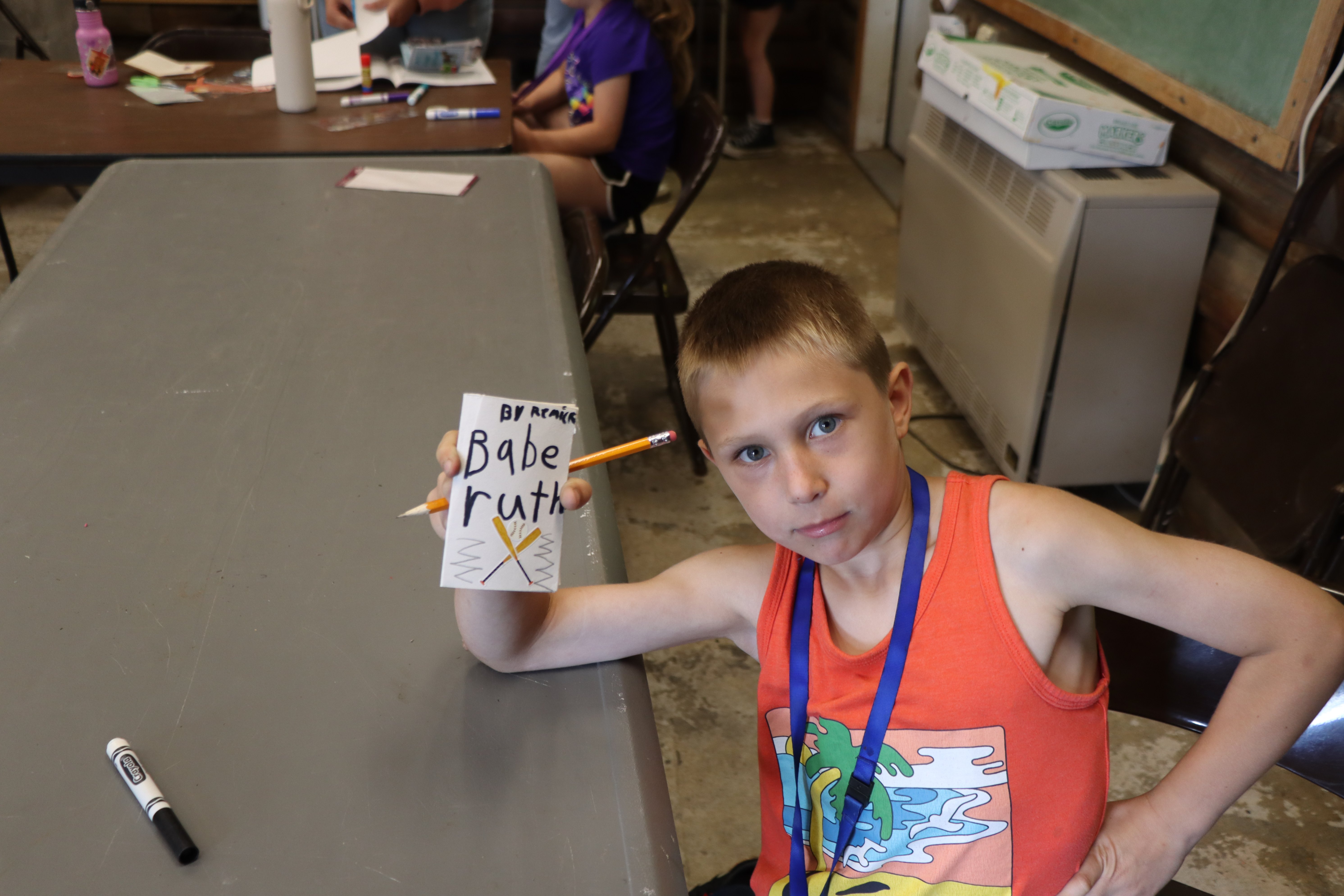 camper showing his Babe Ruth mini-magazine
