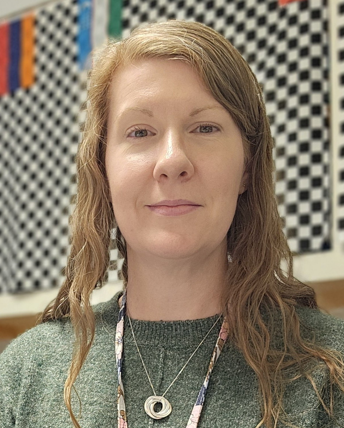 Teacher sitting at desk