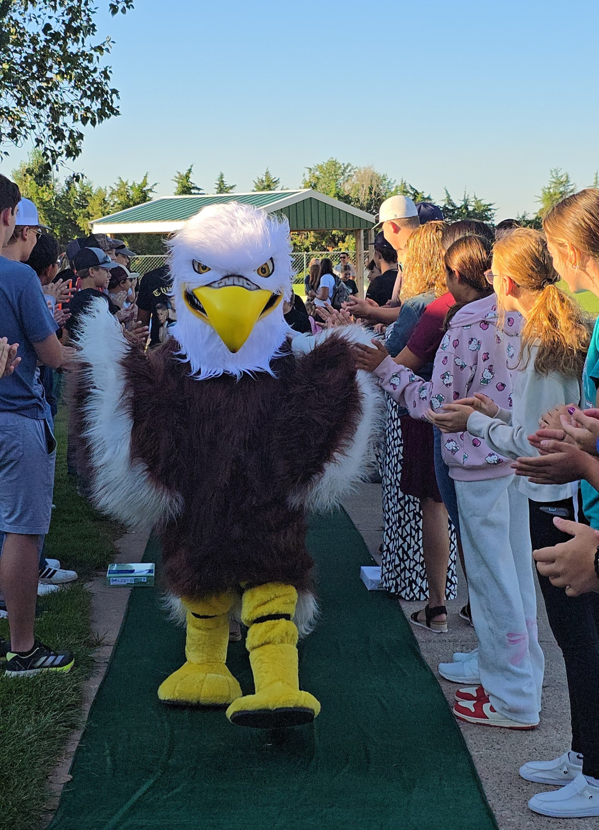 Swoop our Eagle Mascot leading the Elementary students in on their first day of school!