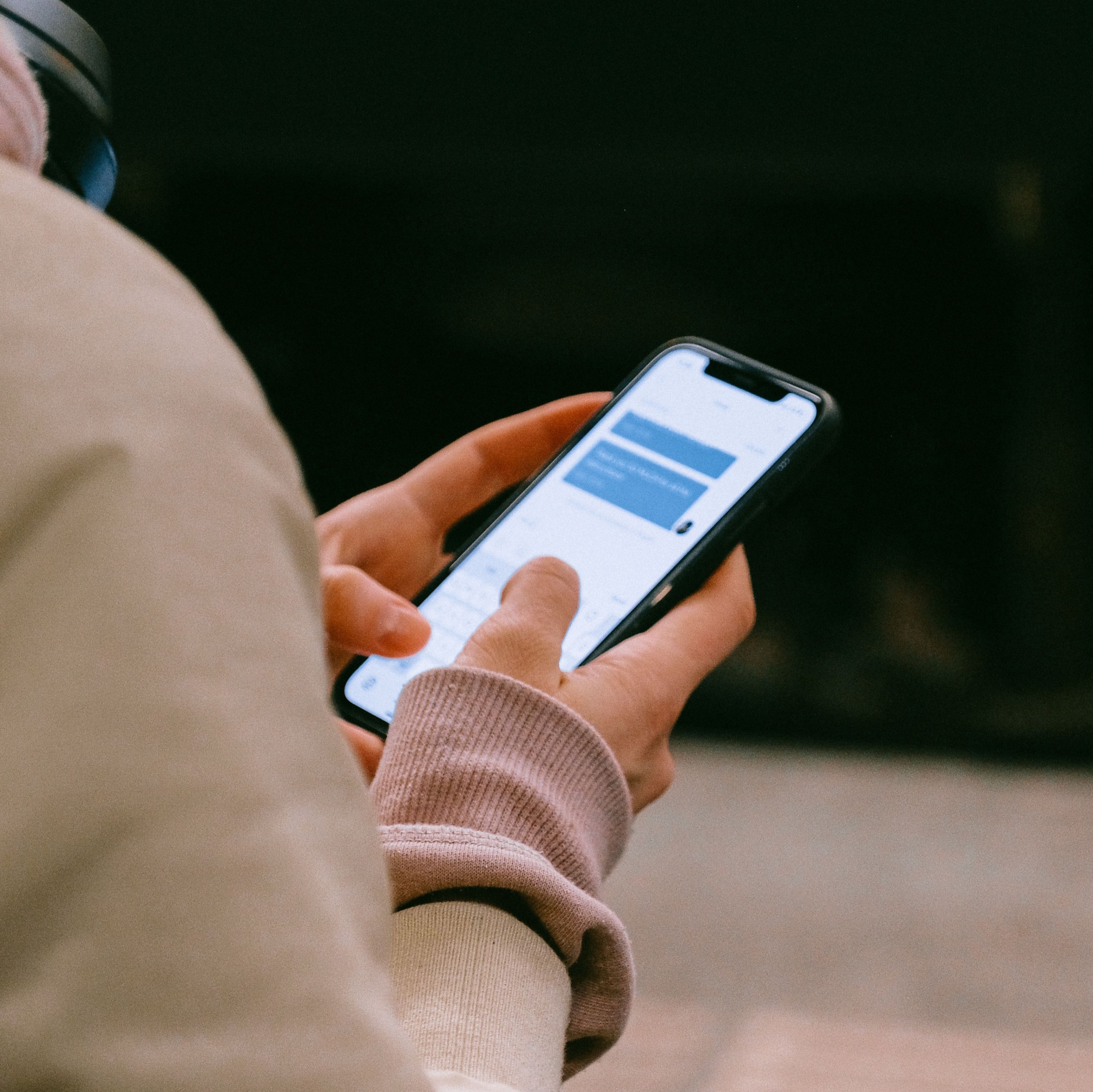 Closeup of person holding a cell phone in their hands