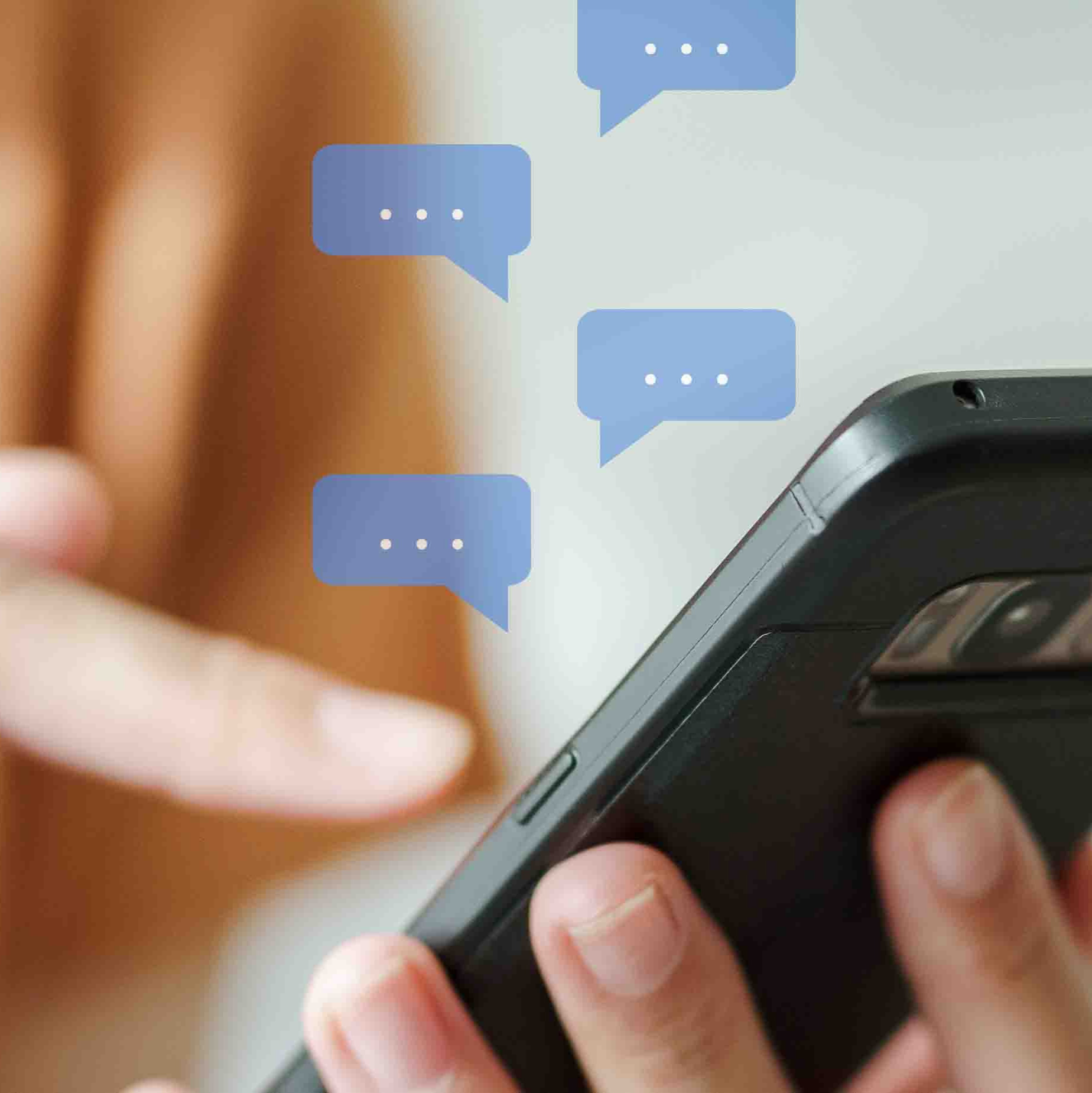 Woman holding a cell phone in her left hand with multiple conversation bubbles floating in the image