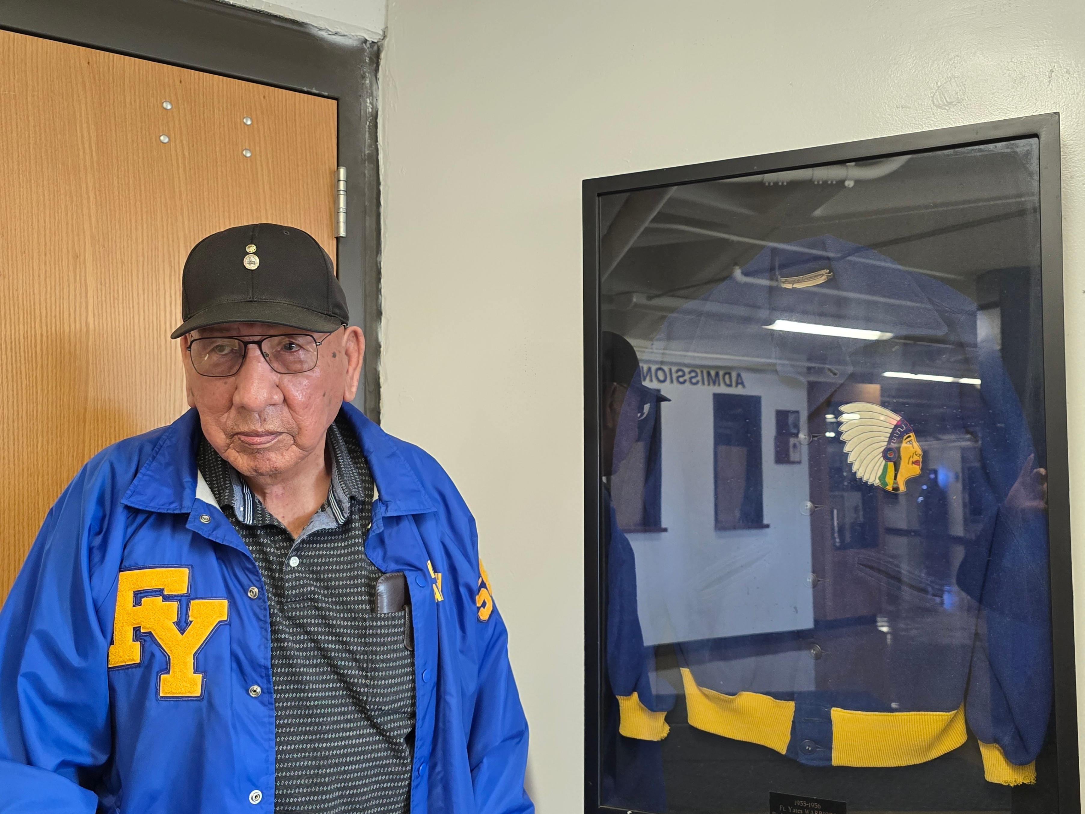 Standing Rock Legendary Warrior: Leonard Village Center poses in his State B Championship jacket. 