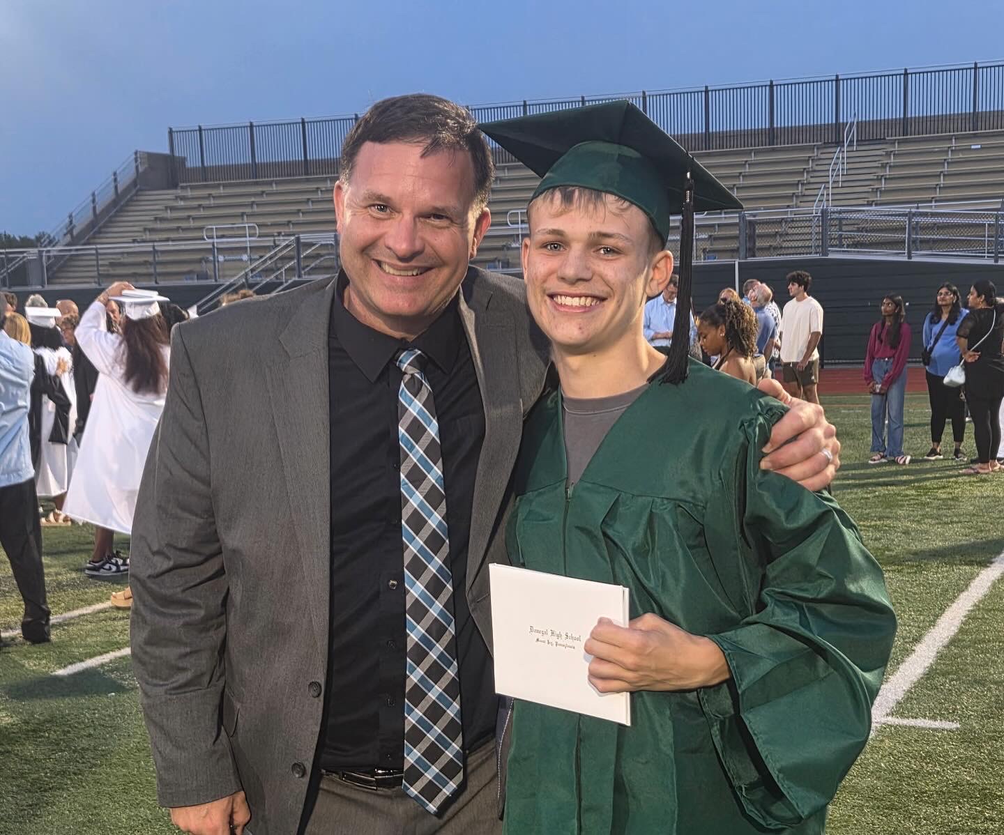 Mr. Sparmblack and student at graduation