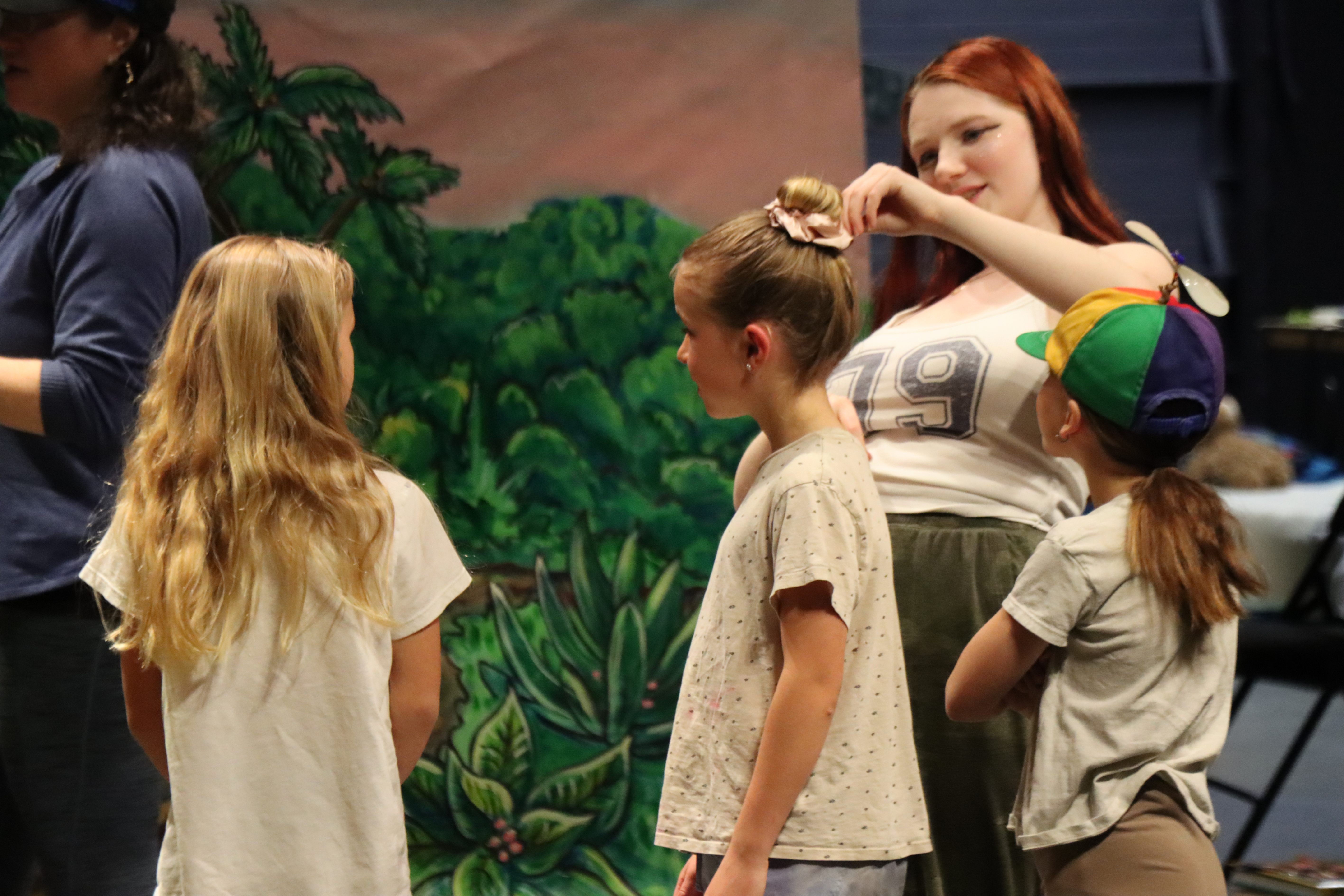 student actors on stage during rehearsal