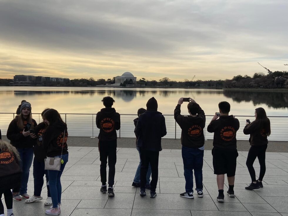 Students looking at the Jefferson Memorial across the Potomac