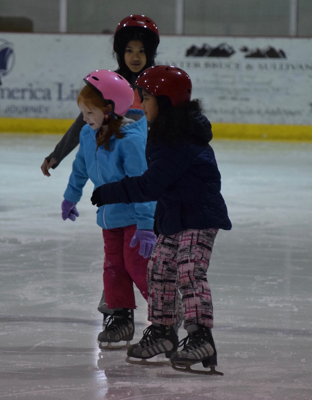 students learning to ice skate