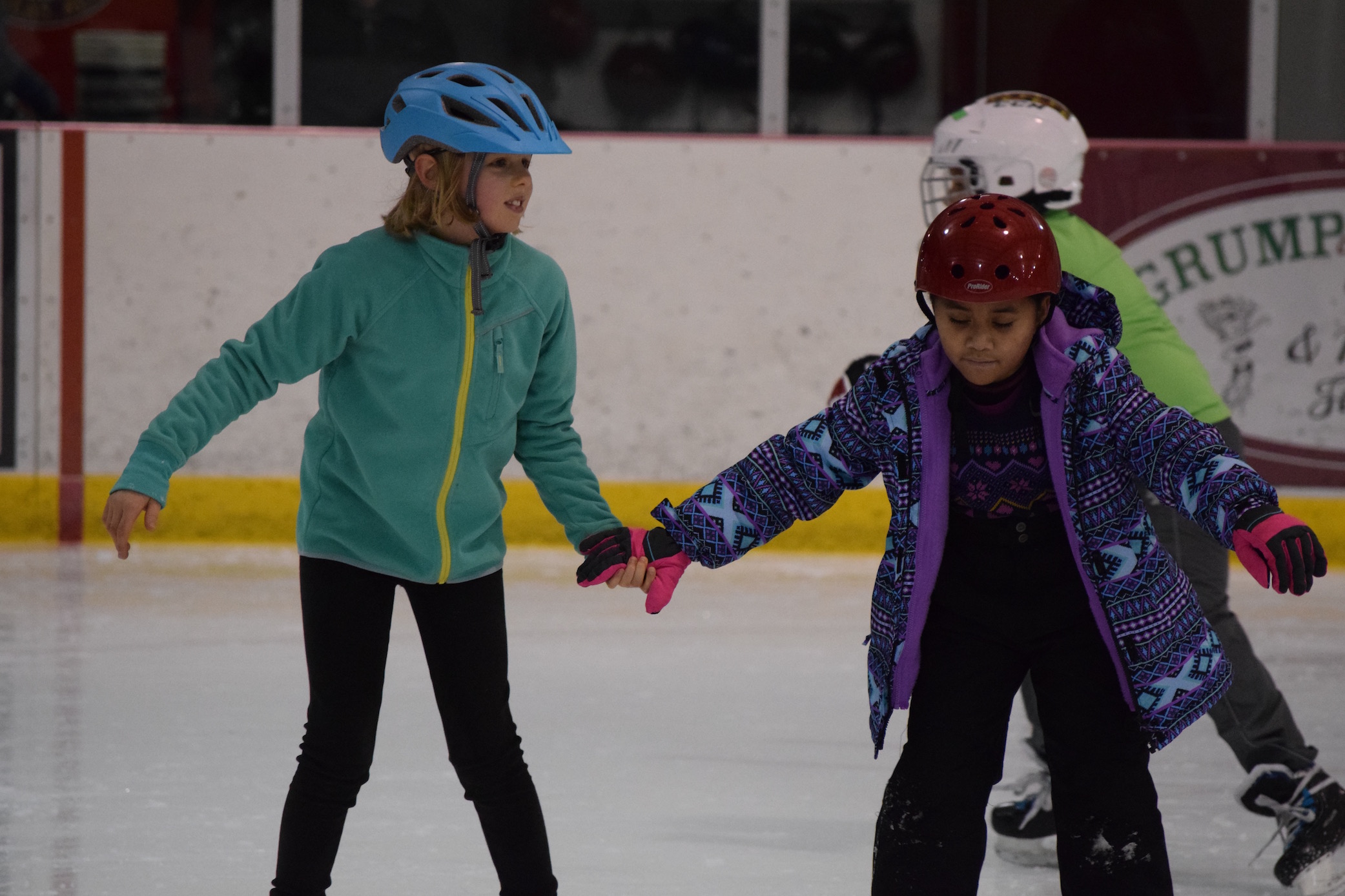 Students learning to skate