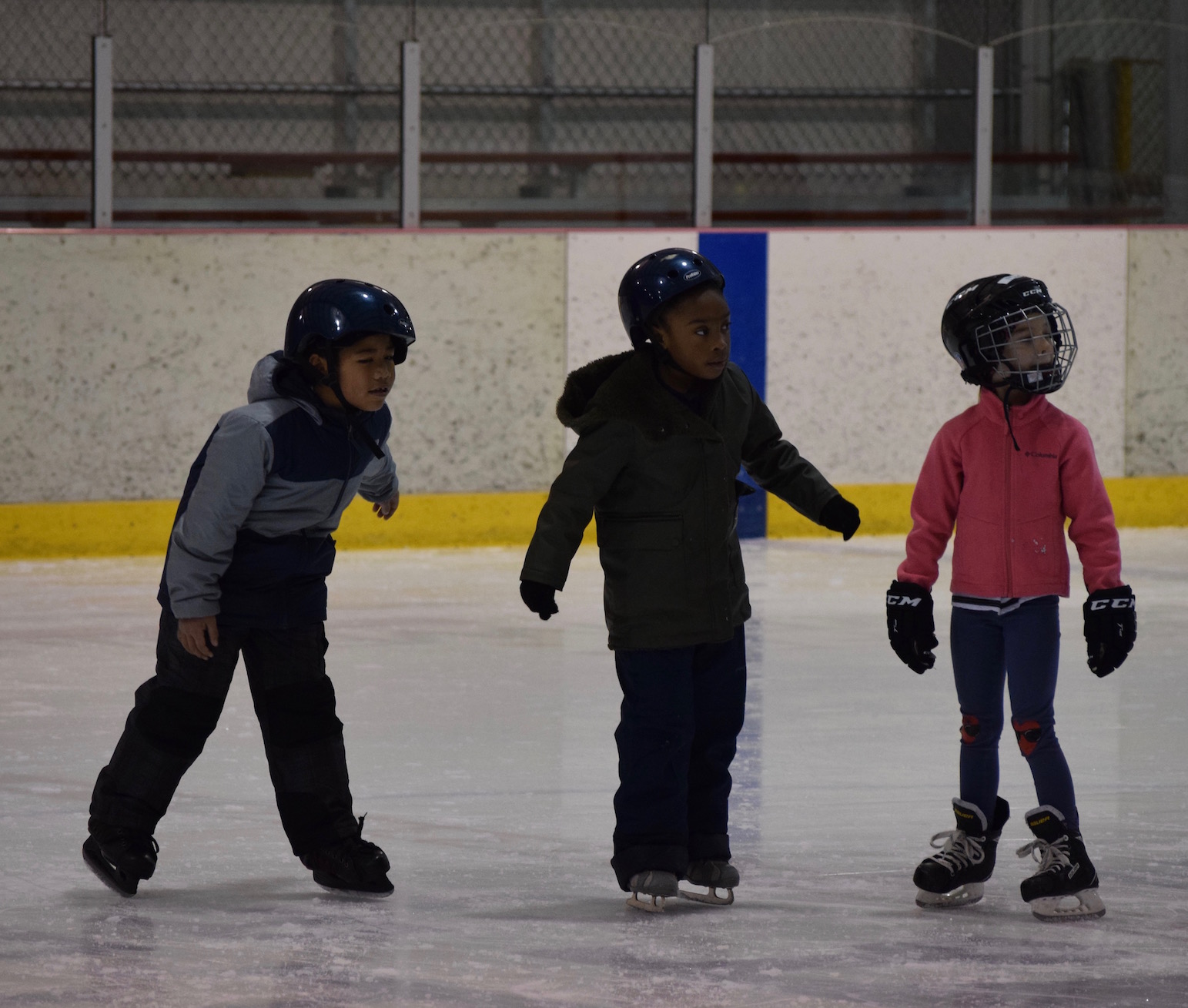 Students learning to skate