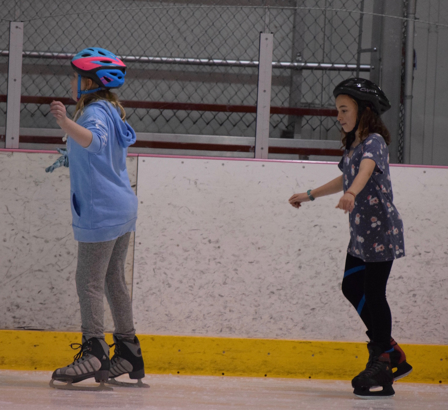 Students learning to ice skate
