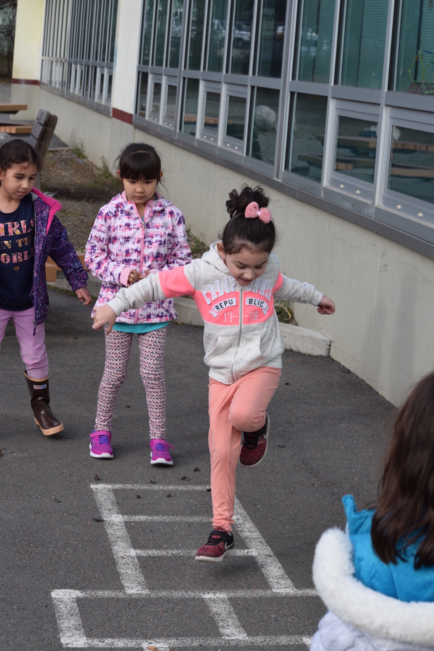 Students playing hop scotch during recess
