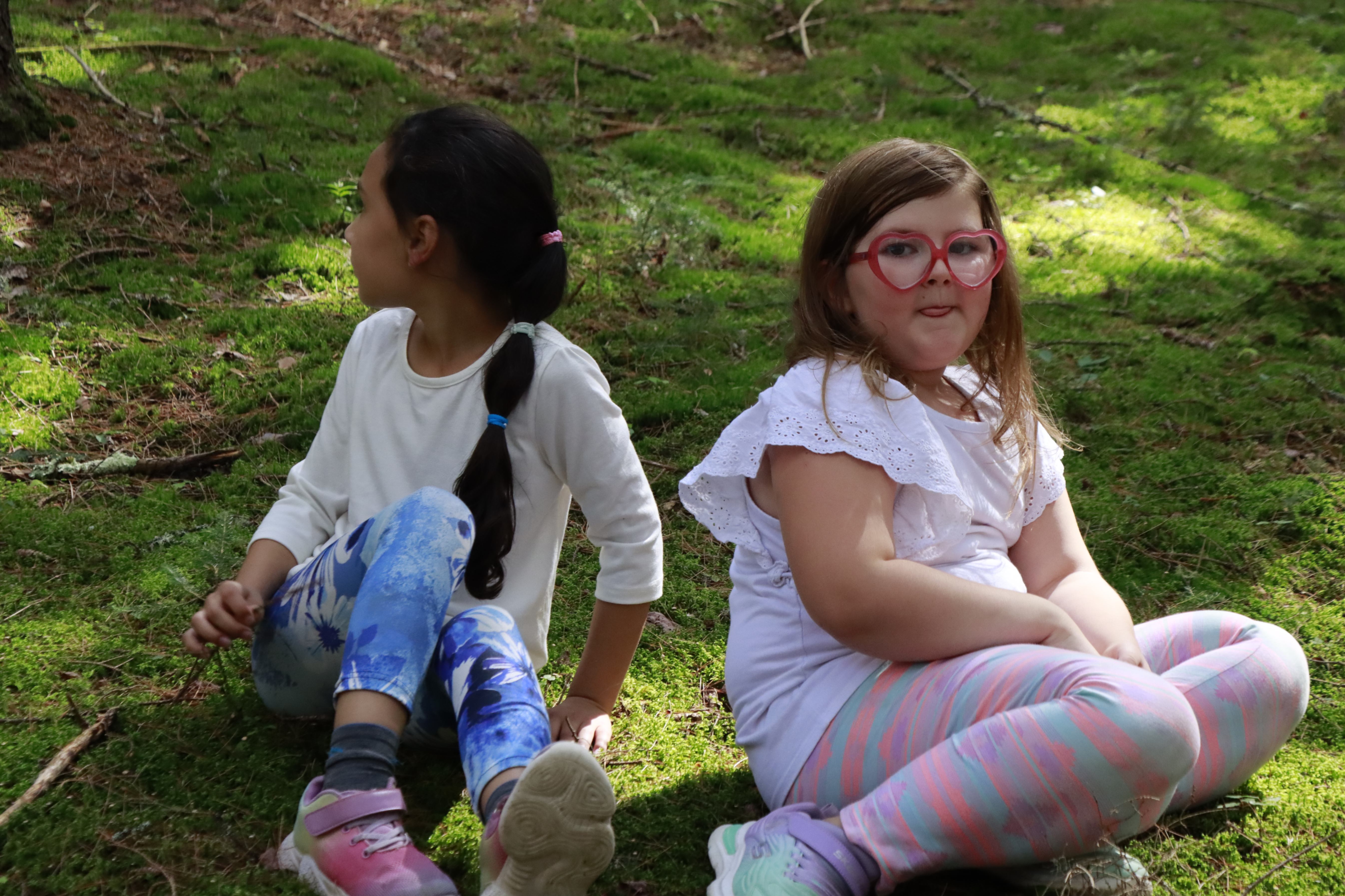 students enjoying the mossy forest floor